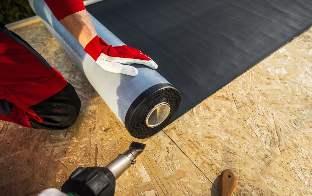 roof worker with roll of epdm rubber membrane 2025 03 13 21 37 45 utc